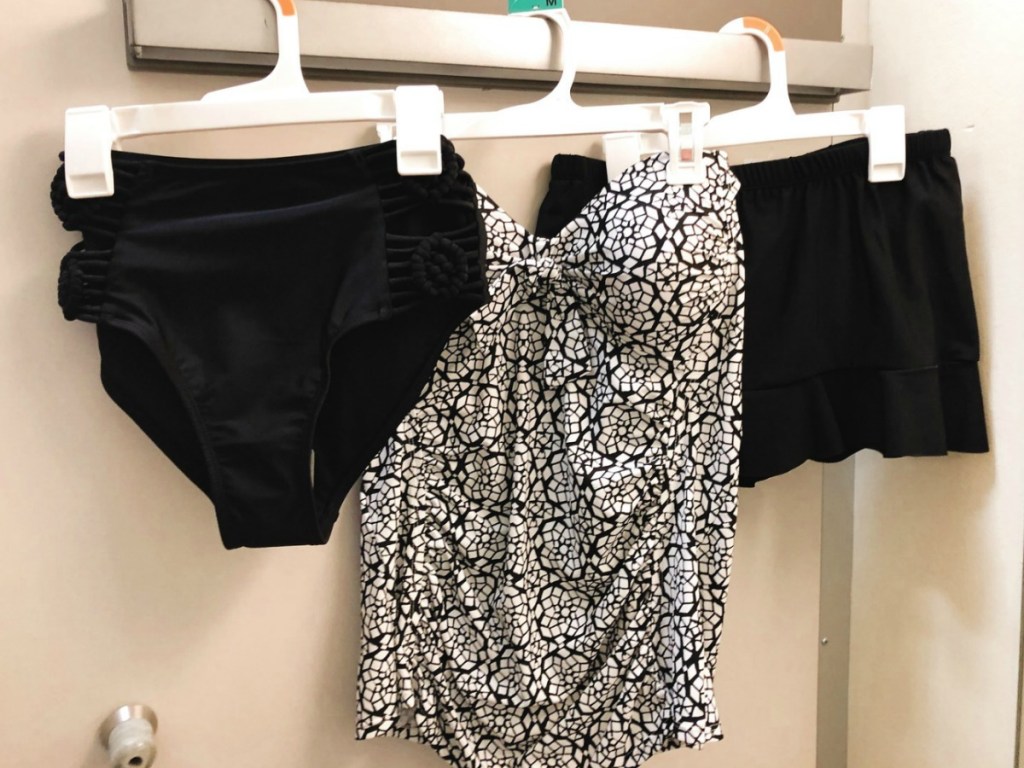 Geometric black and white tankini with bottoms hanging in dressing room