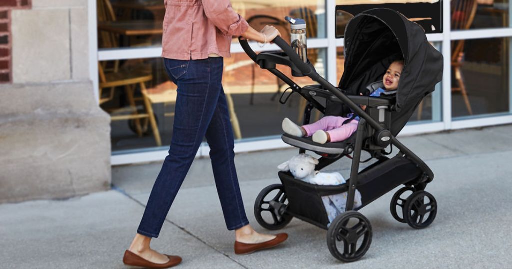 mom pushing baby in Graco Modes Stroller
