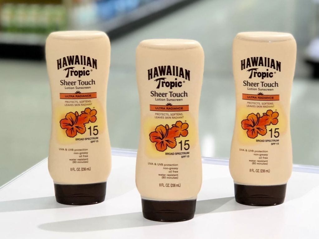 Hawaiian tropic sheer touch lotion sunscreen in 15 sph 3 count on white countertop