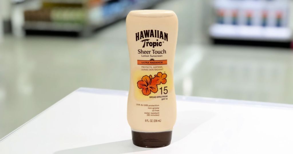 Hawaiian tropic sheer touch lotion sunscreen in 15 sph on white countertop