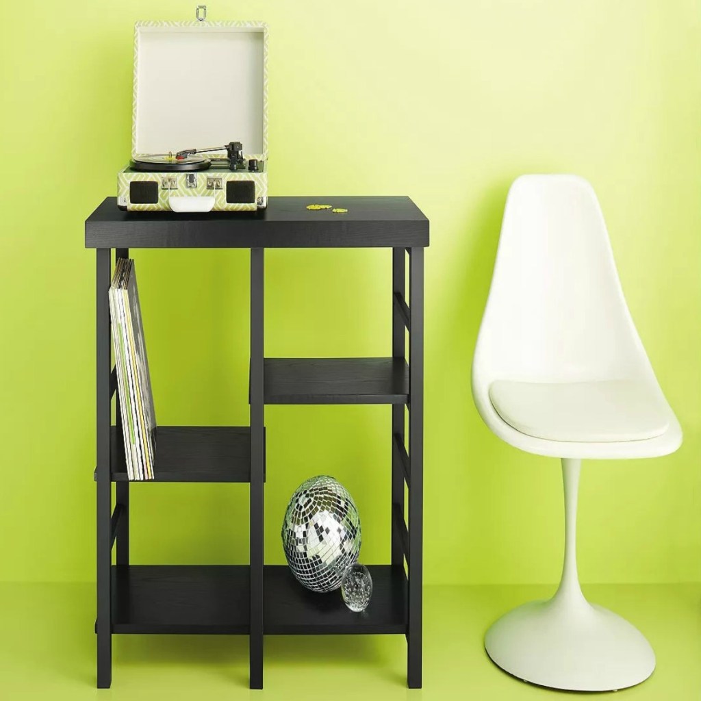 Black bookcase shelving with record player and white chair