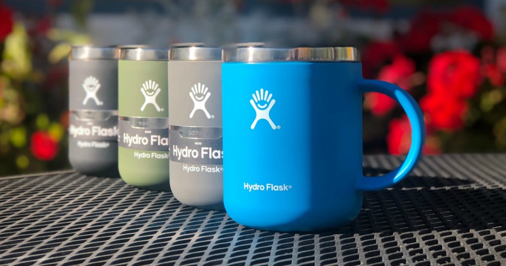 Four Hydro Flask Mugs on black grated table