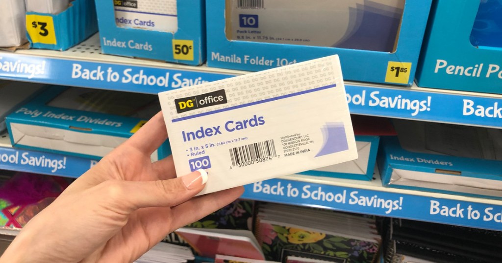 woman holding index cards at store