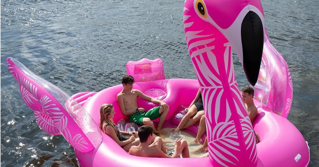 people on an inflatable flamingo