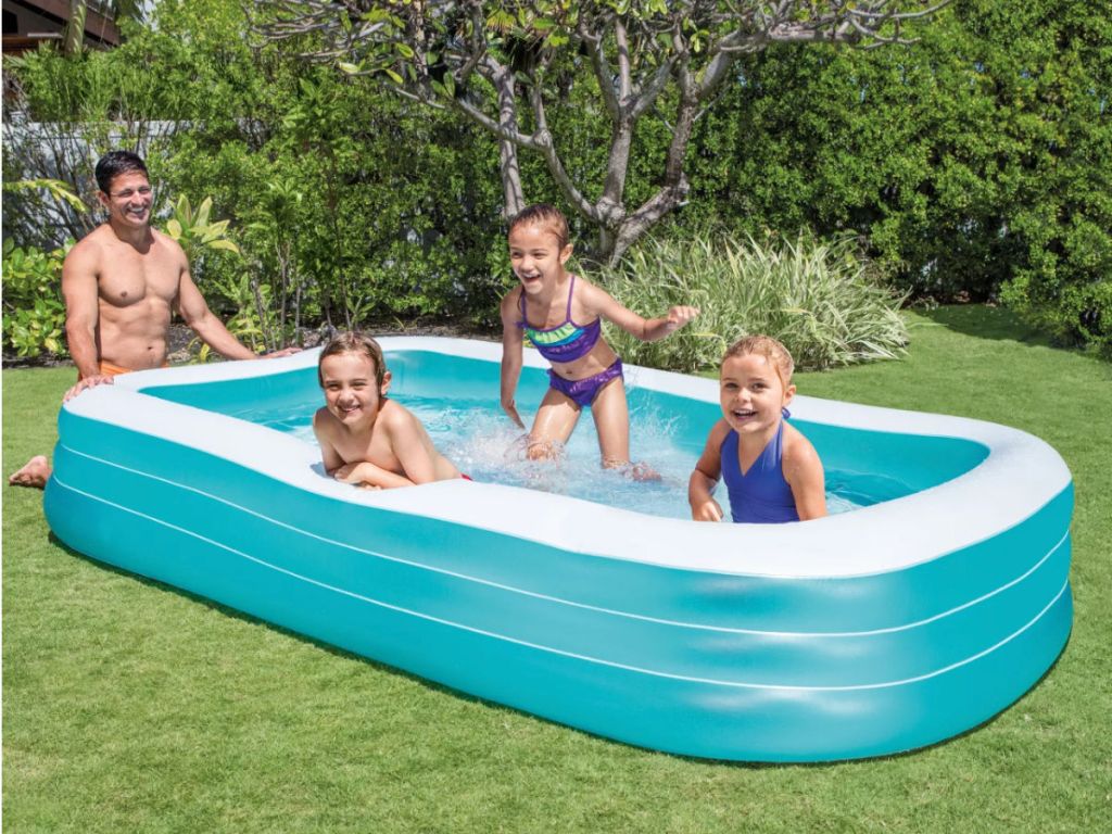 family in intex swim center inflatable pool