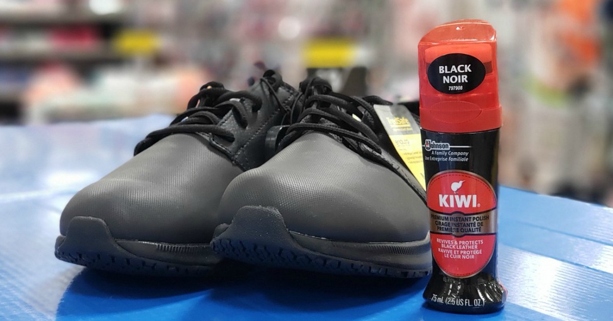 black pair of men's shoes next to KIWI shoe polish