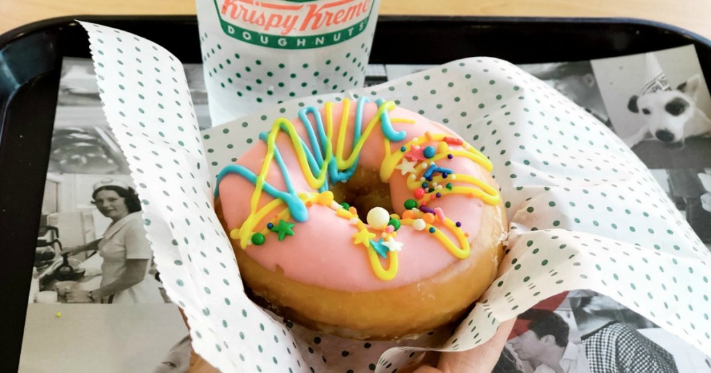 krispy kreme colorful doughnut and coffee cup on a tray