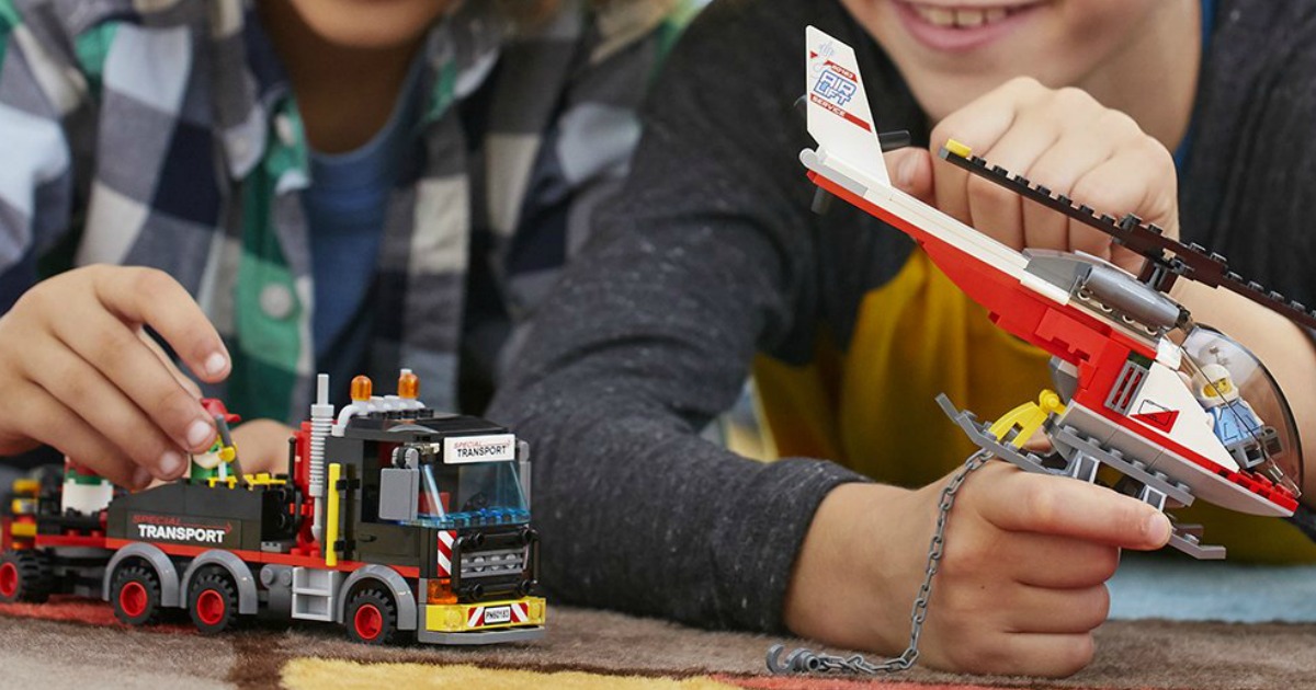kids playing with LEGO City Heavy Cargo Transport Building Kit