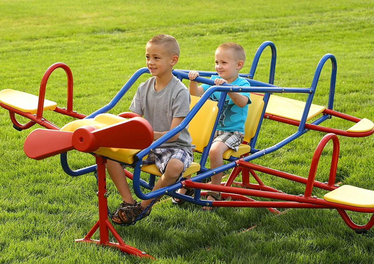 Lifetime Ace Flyer Teeter-Totter with two boys playing in yard