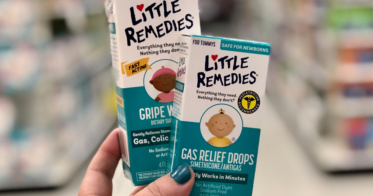 two Little Remedies products being held by a hand in store