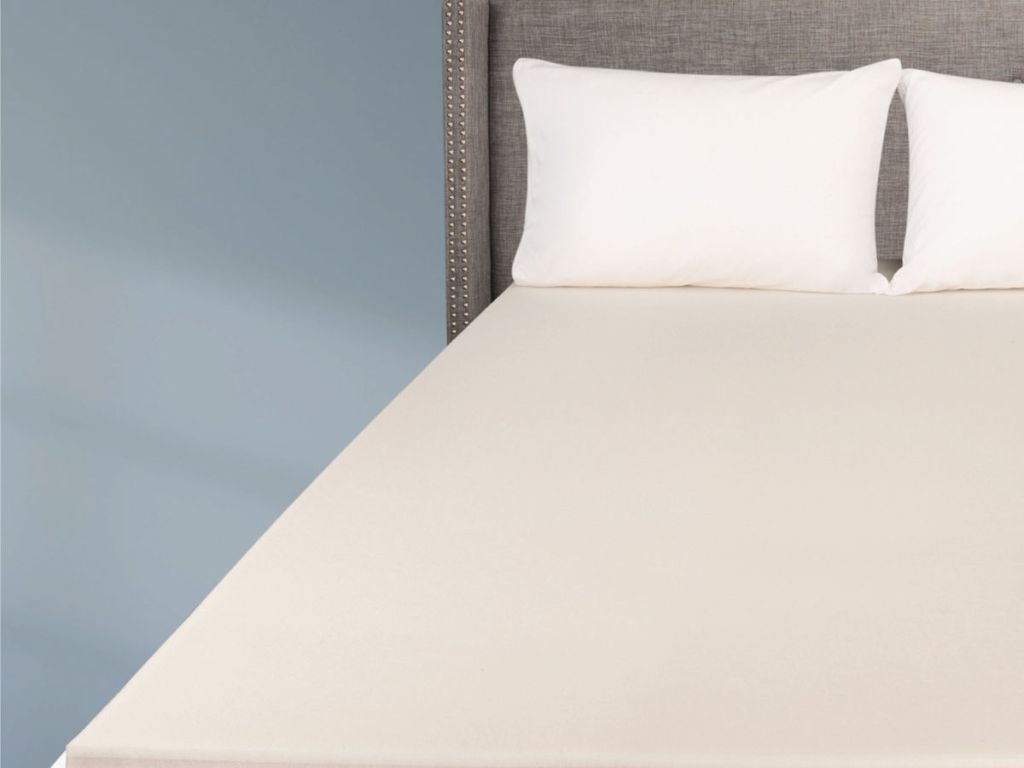 Mainstay Memory Foam Mattress Topper on bed with pillows