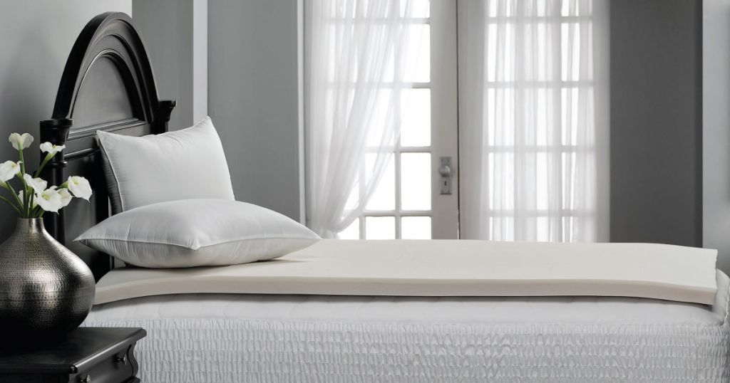 Mainstay Memory Foam Mattress Topper side view on bed with pillows