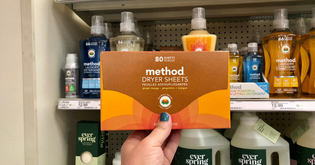 woman holding box of method dryer sheets at target