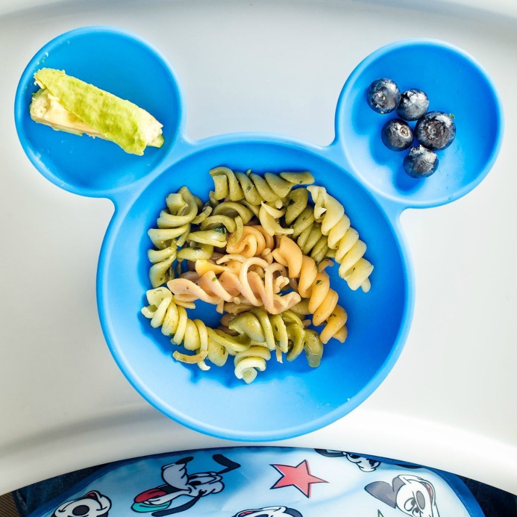 Mickey silicone bowl with pasta, blueberries and avocado in it!