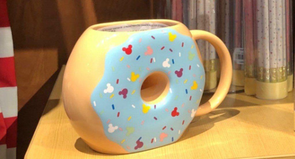 Donut-shaped Disney Mickey Mouse Ceramic Mug on shelf in Disney Store