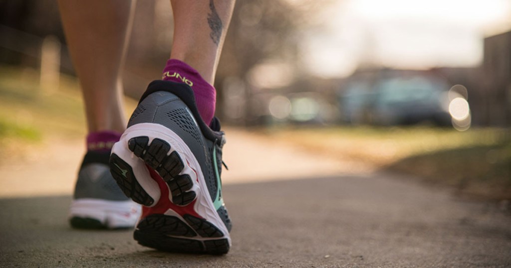 woman wearing mizuno wave rider 22 running shoes