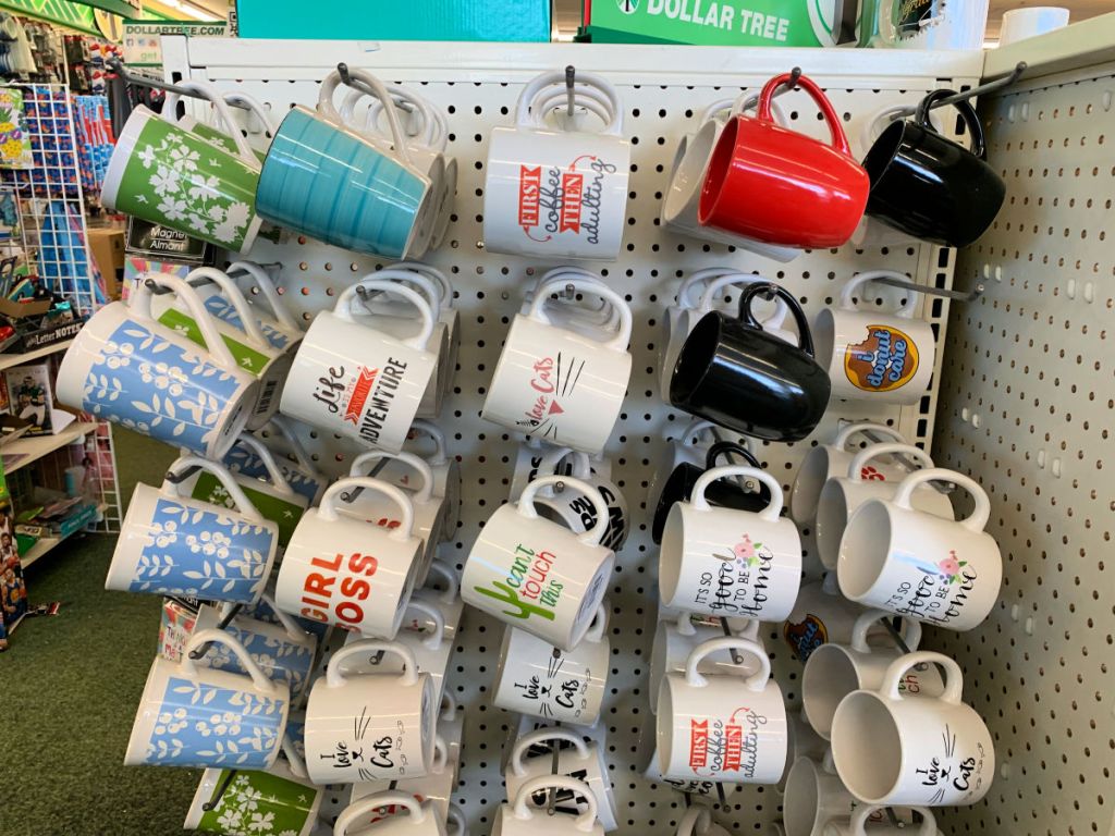 Display of coffee mugs on peg board at dollar tree