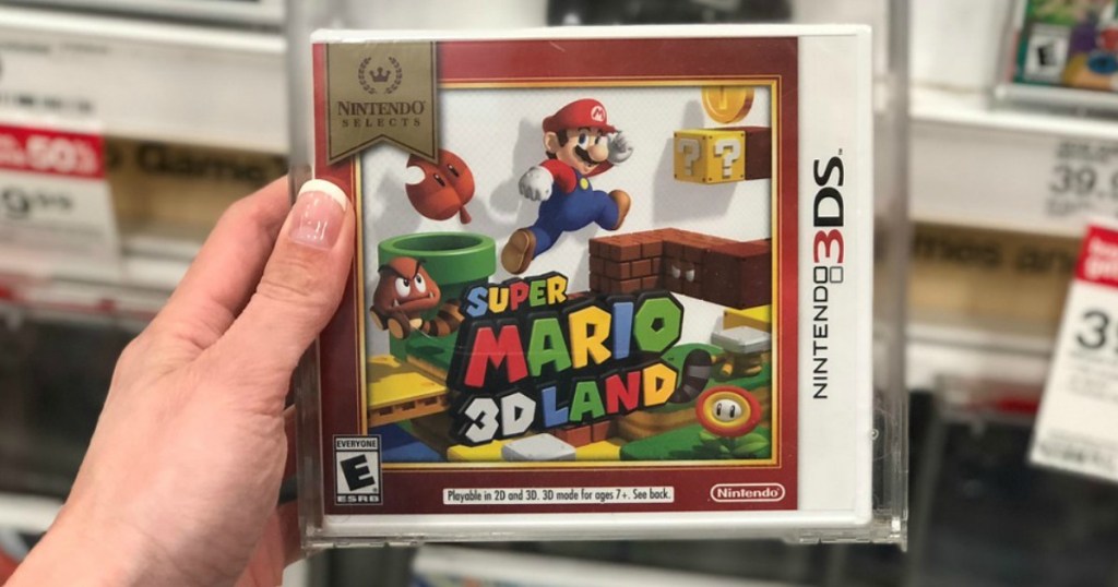 hand holding mario 3ds game in store