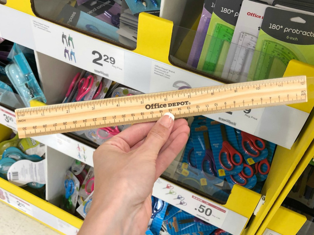 Office Depot Ruler Being Held by a woman
