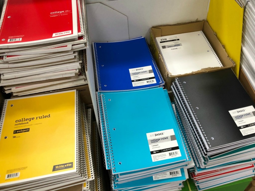 Bin full of colorful spiral notebooks