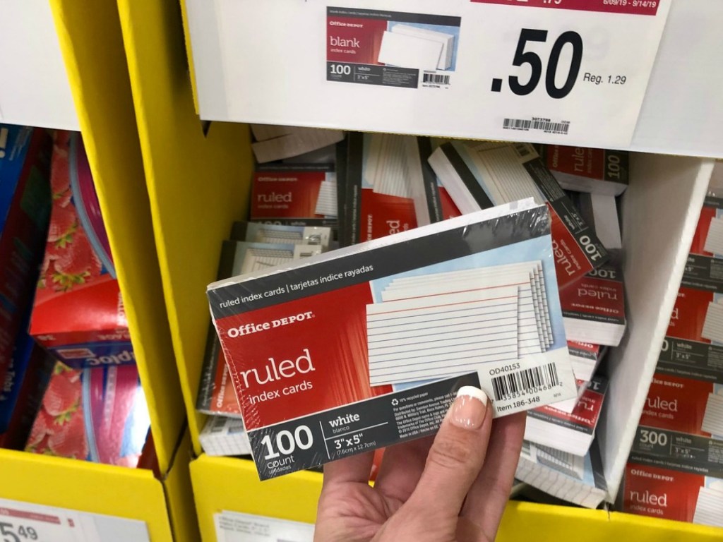 Index Cards held up in front of school supply display