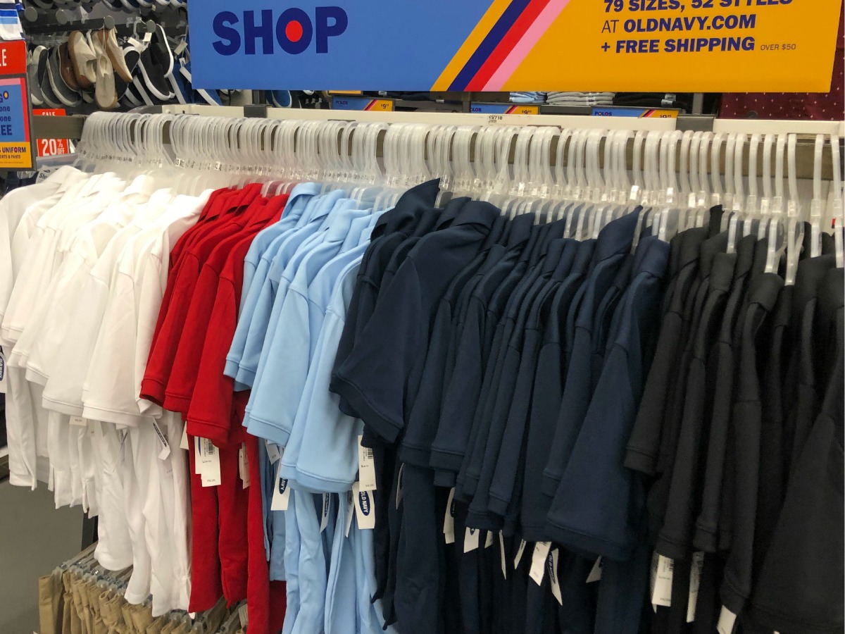 Old Navy uniform polos hanging on a store display rack