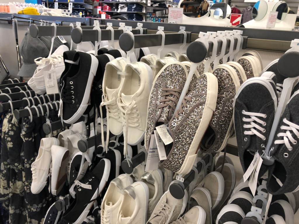 Women's sneakers hanging on hooks at Old Navy 