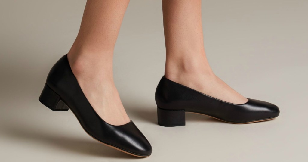 womens legs modeling black leather block heels