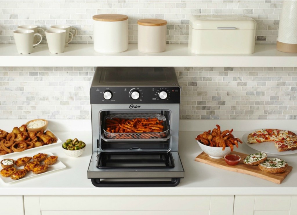 Oster Air Fryer Toaster Oven on kitchen counter with yummy air-fried foods