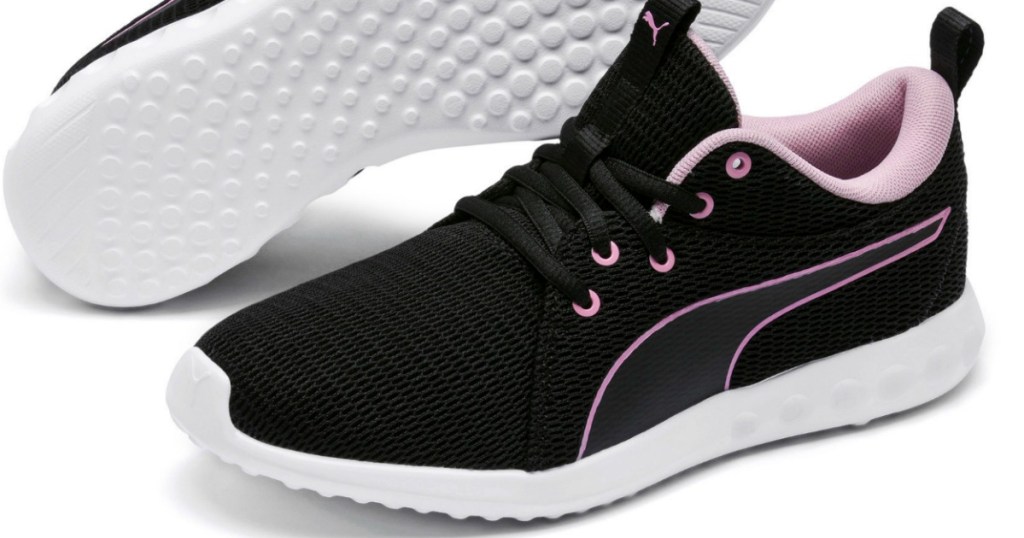 Black running shoes with Pink details and white sole