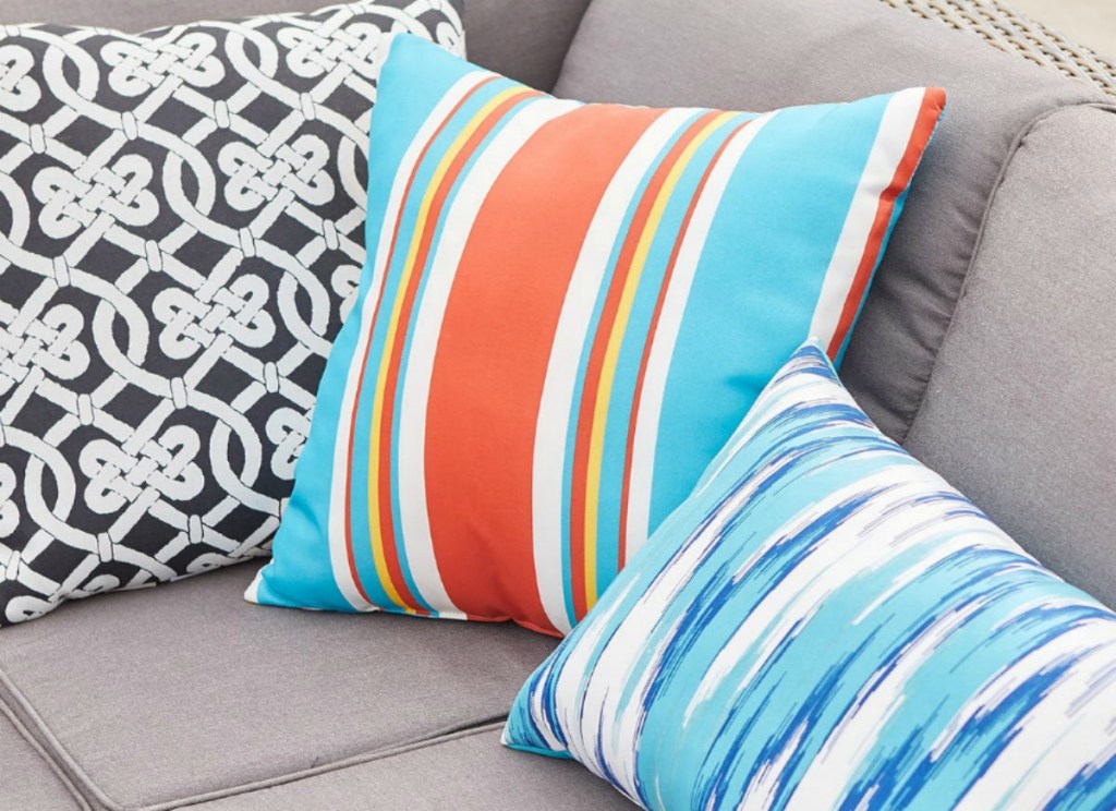 Pier 1 pillows on gray couch