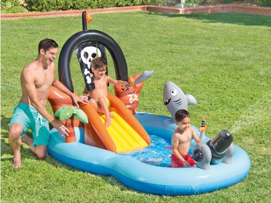 family playing in Pirate Play Center Inflatable Pool with Sprayer