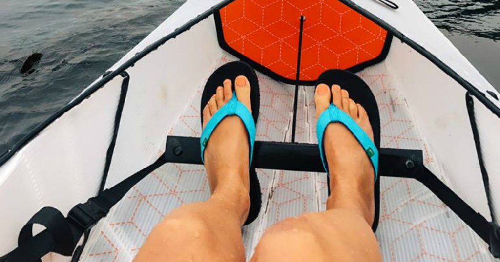 Sanuk Women's Hawaiian Ocean Yoga Flip-Flops on a canoe