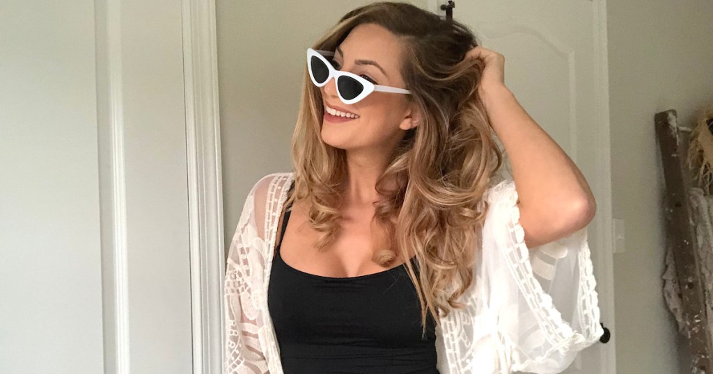 woman wearing white cateye sunglasses