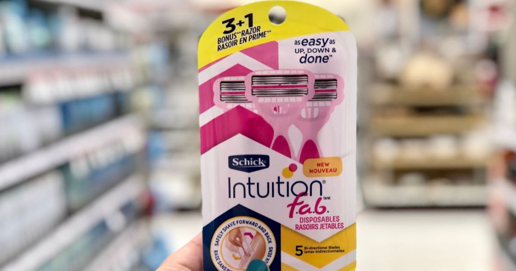 hand holding Schick Intuition Fab Disposable at Target