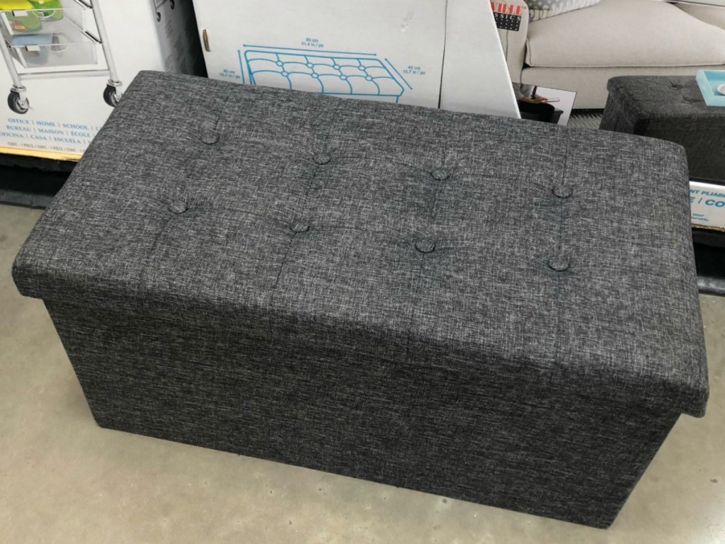 gray bench with tufted top in store