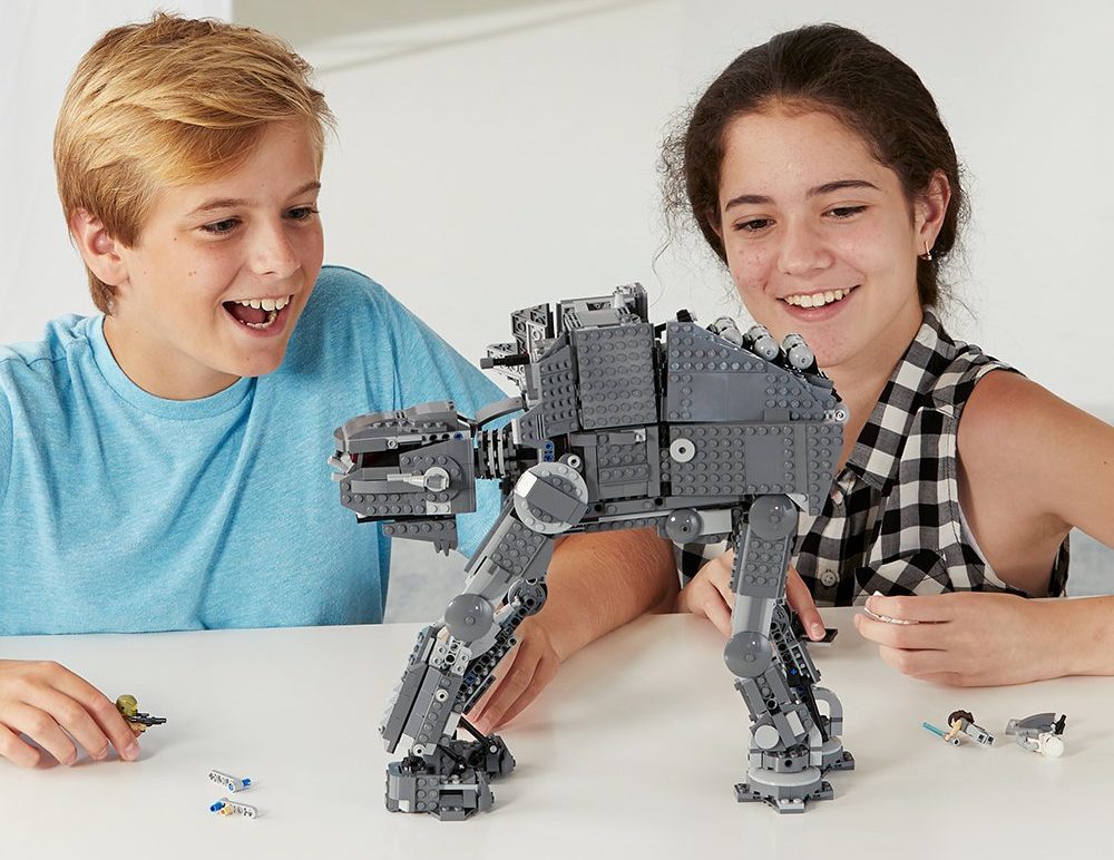 kids playing with LEGO Star Wars set