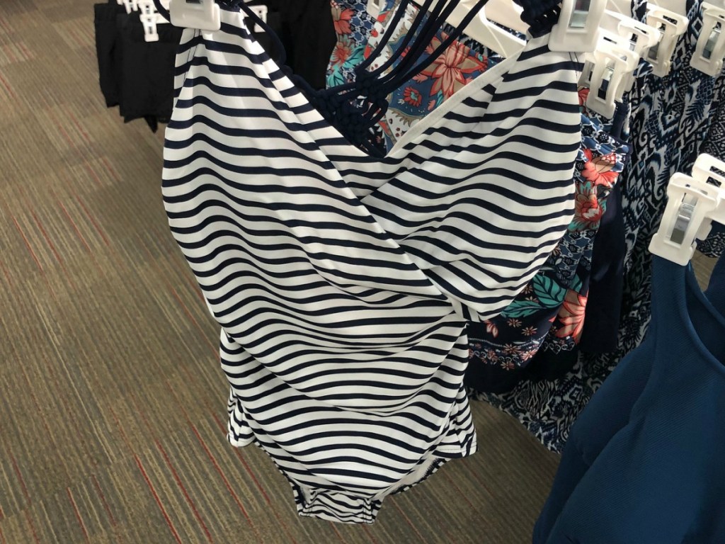 striped one-piece swimsuit on hanger