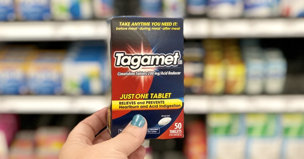 woman holding box of tagamet at target