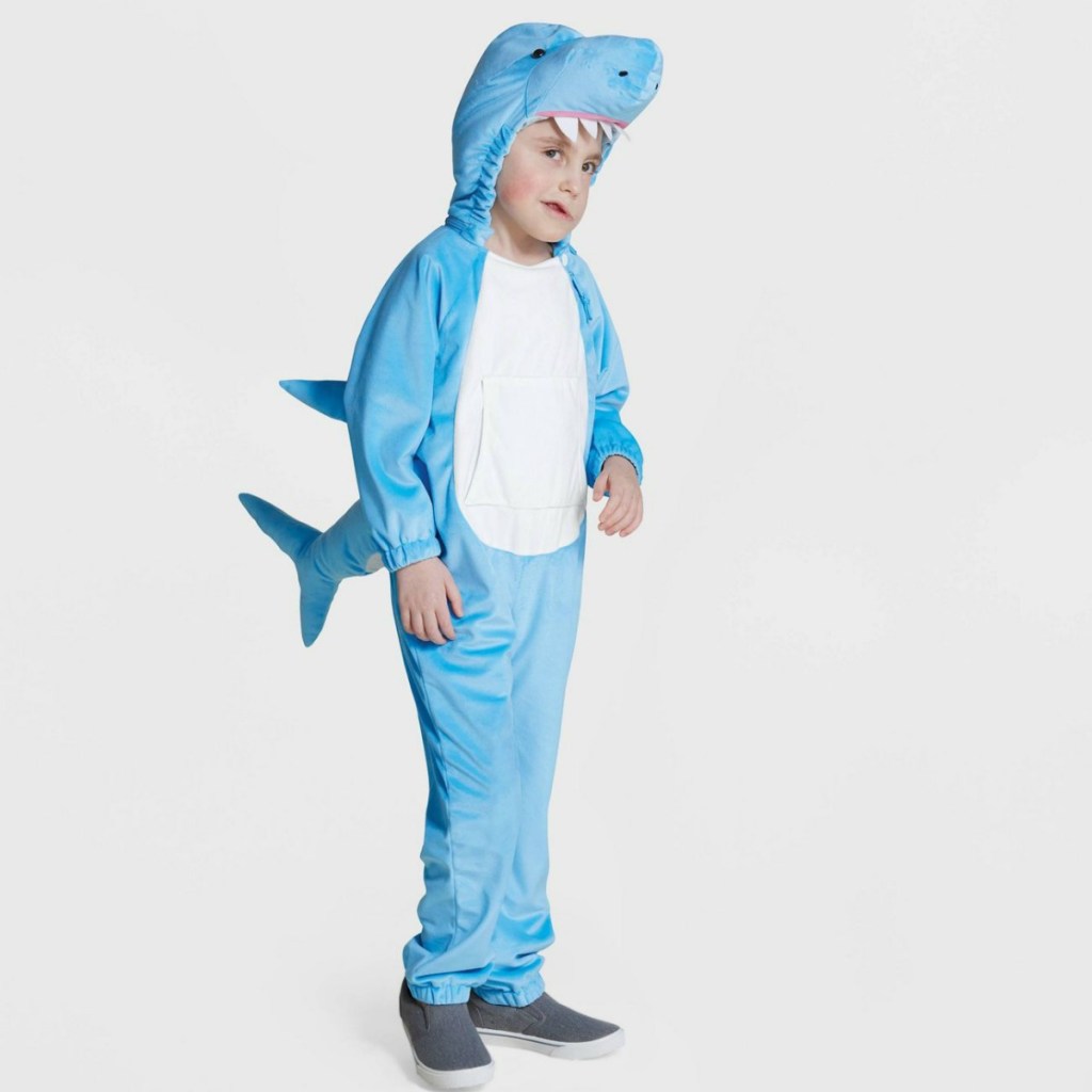 Boy wearing adaptive shark costume