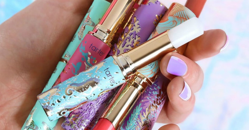 hand holding Tarte Quench Lip Rescue