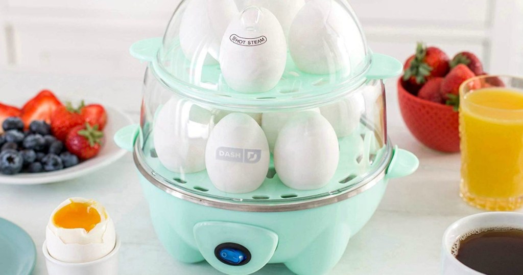 Teal colored Dash Deluxe Rapid Egg cooker filled with eggs