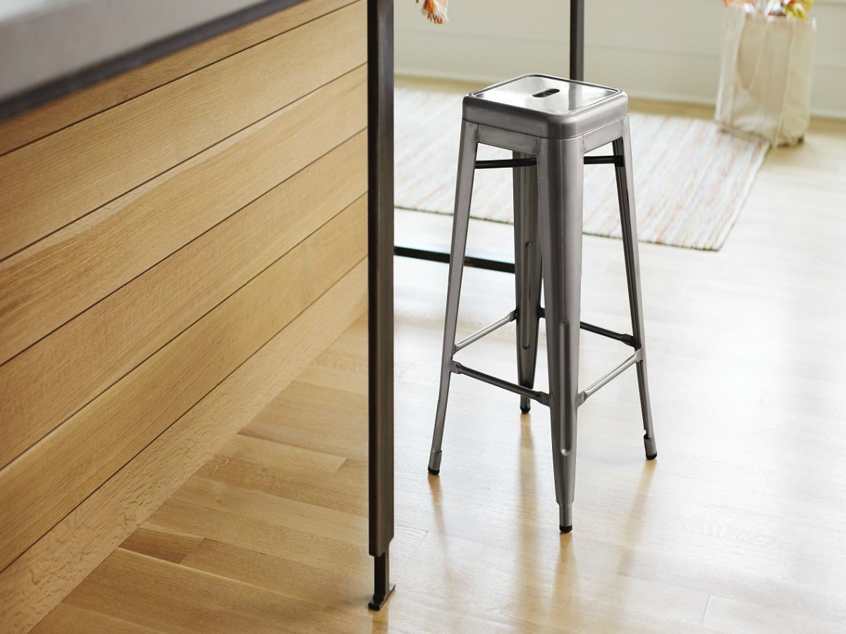 metal stool on wooden kitchen floor