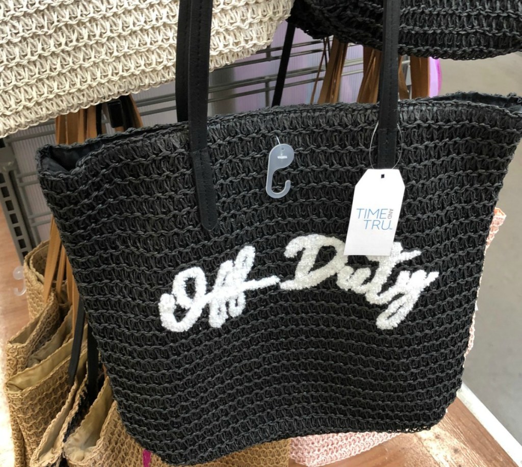 Black straw tote bag with words "off duty"