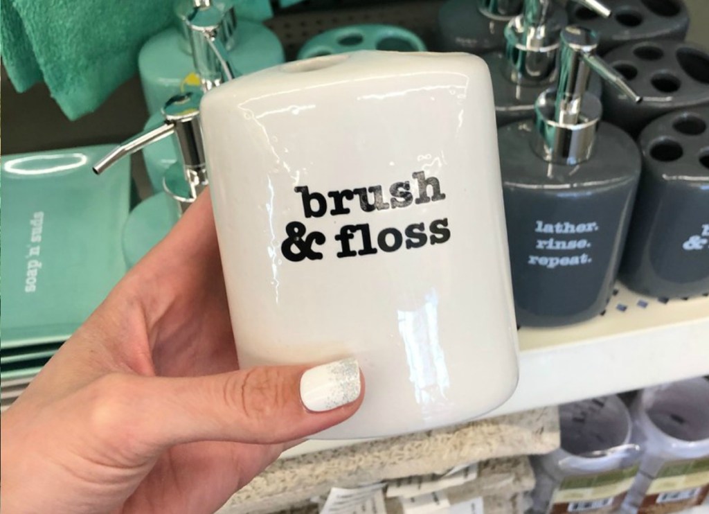 White toothbrush holder in store in front of display