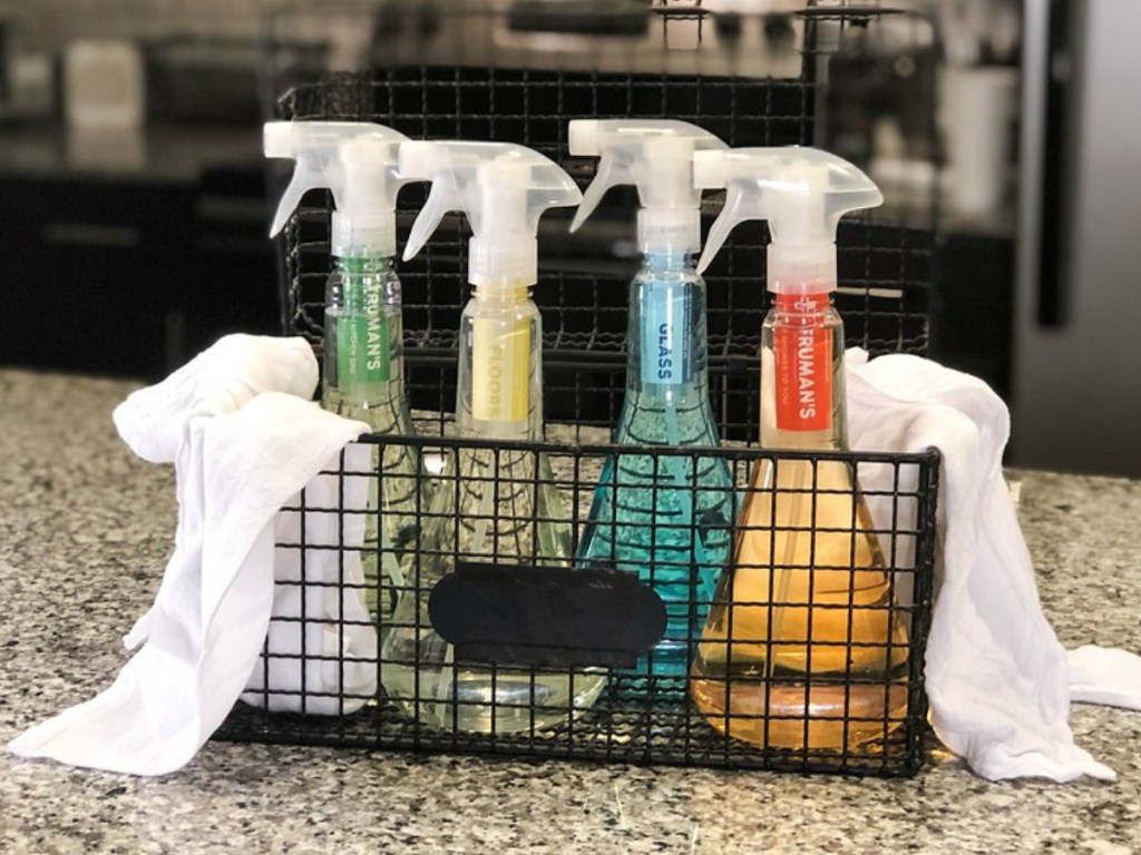 four bottles of Truman's cleaners in a wire basket on the kitchen counter