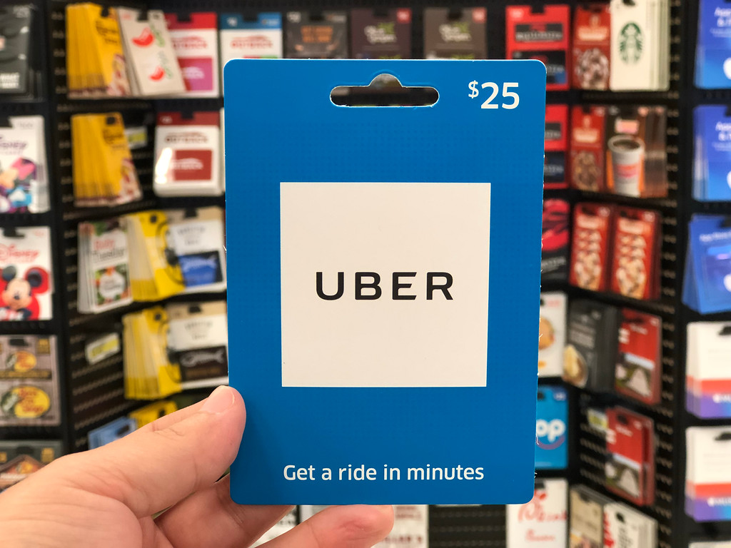 UBER Gift Card being held by a man's hand