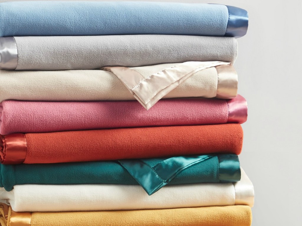 Martha Stewart Soft Fleece Blankets folded up on top of each other