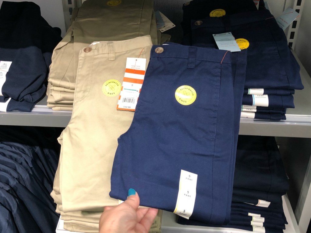 Folded uniform pants on display shelf at Target