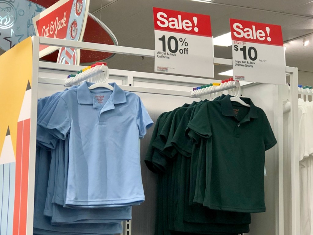 Uniform Polo Tops hanging on target display